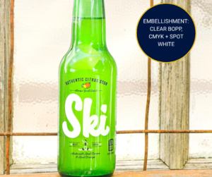 beverage bottle with label printed with spot white